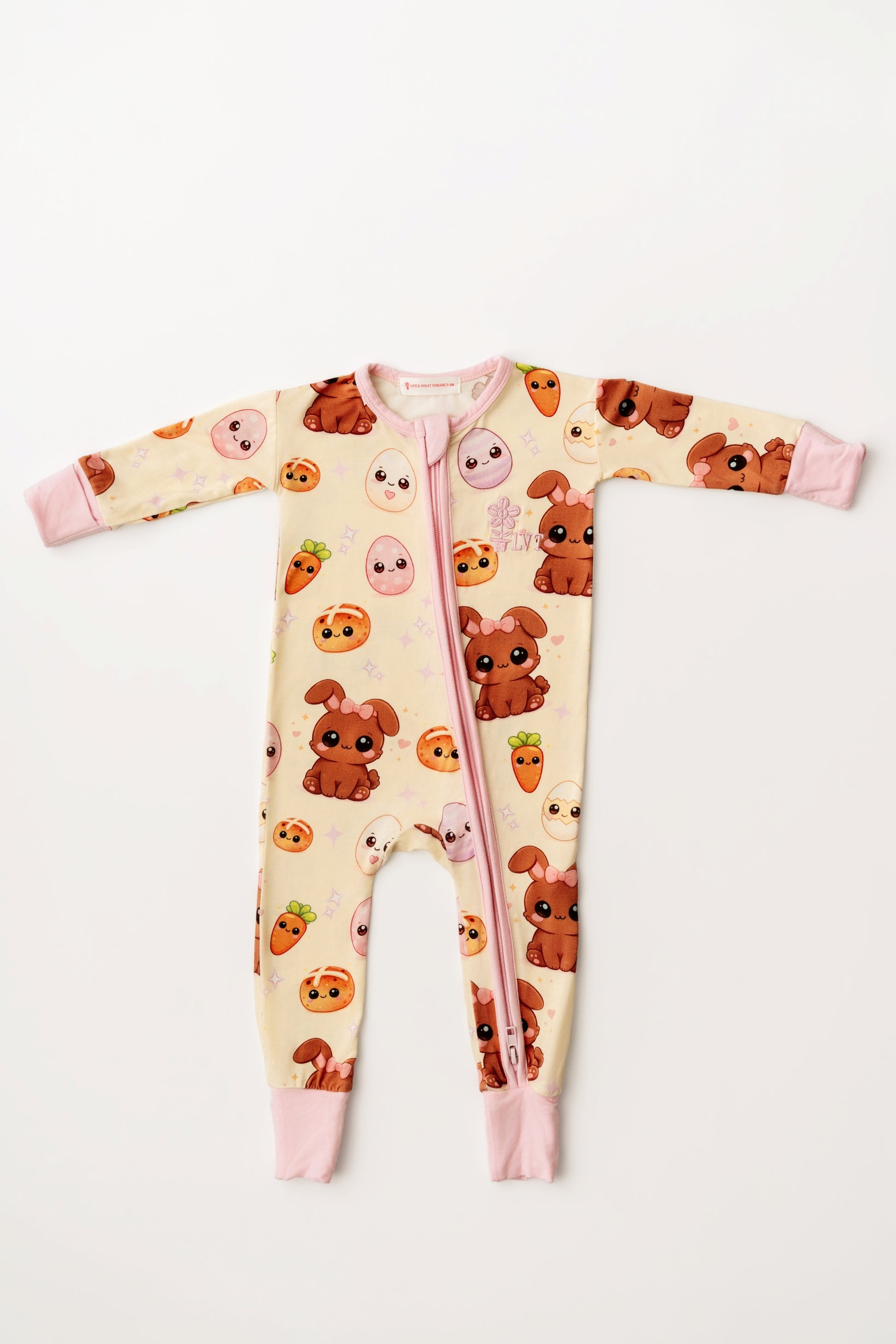 Pink Easter Bunny bamboo zip romper laid flat on white background