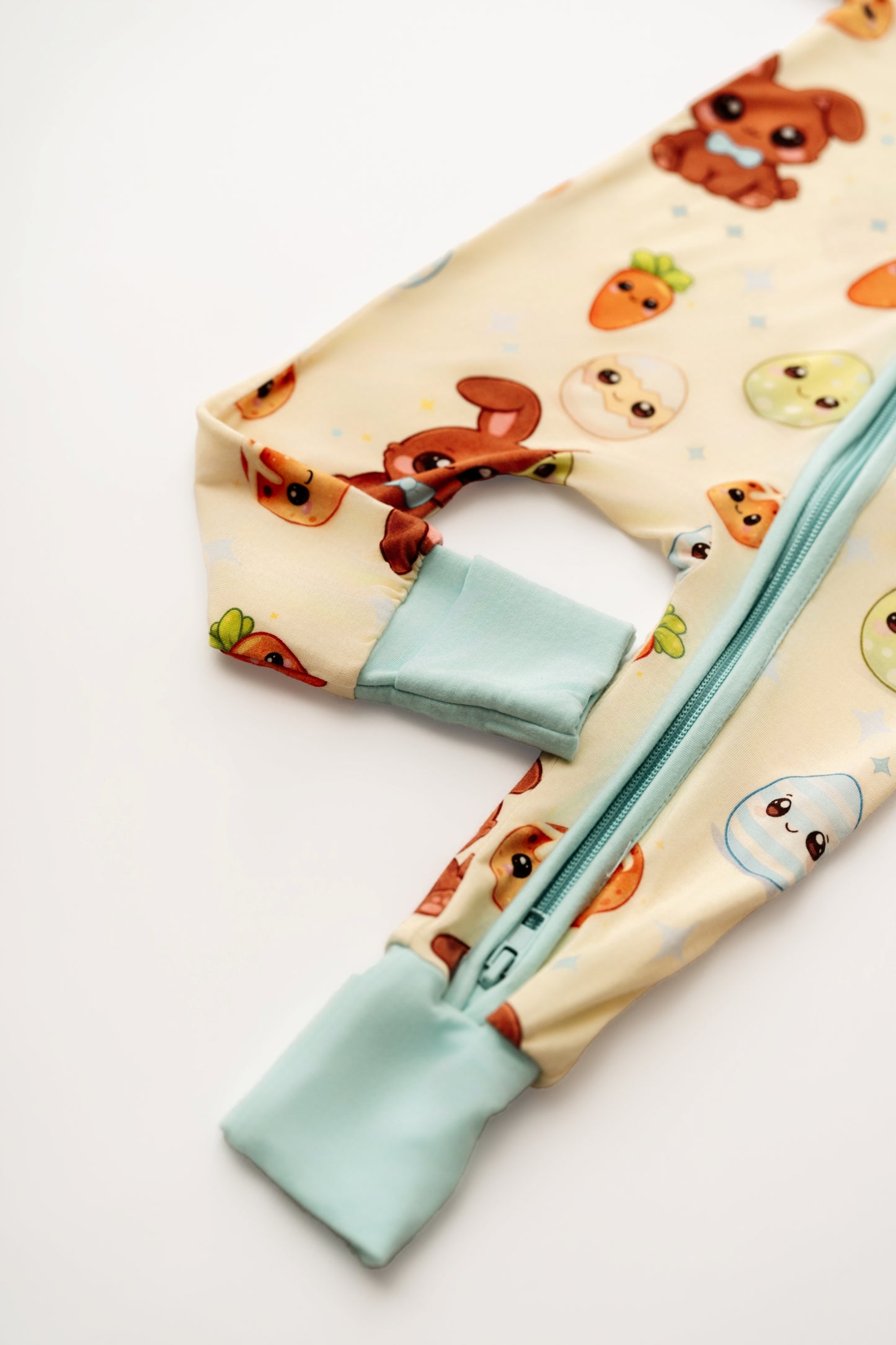 Close up of Blue Bunny bamboo zip romper cuff and zipper detail