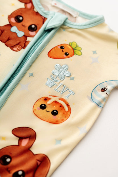 Close up of Blue Bunny bamboo zip romper print and zipper detail