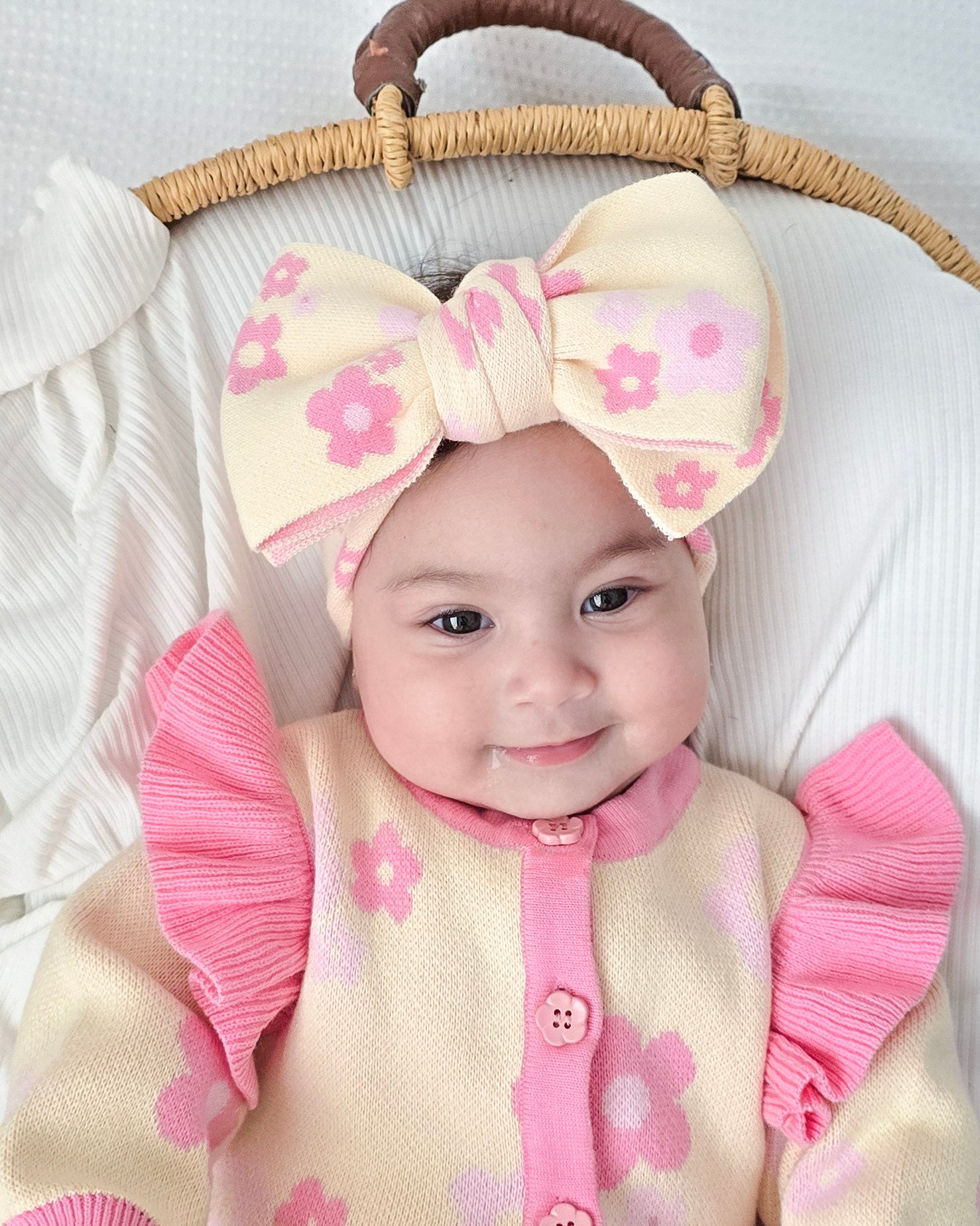 Baby girl wearing the Buttercup Princess floral bow headband by Little Violet Threads