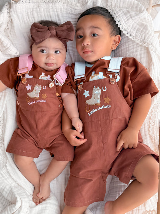 Babies wearing Little Violet Threads Little Outlaw matching western overalls in boys and girls colourways
