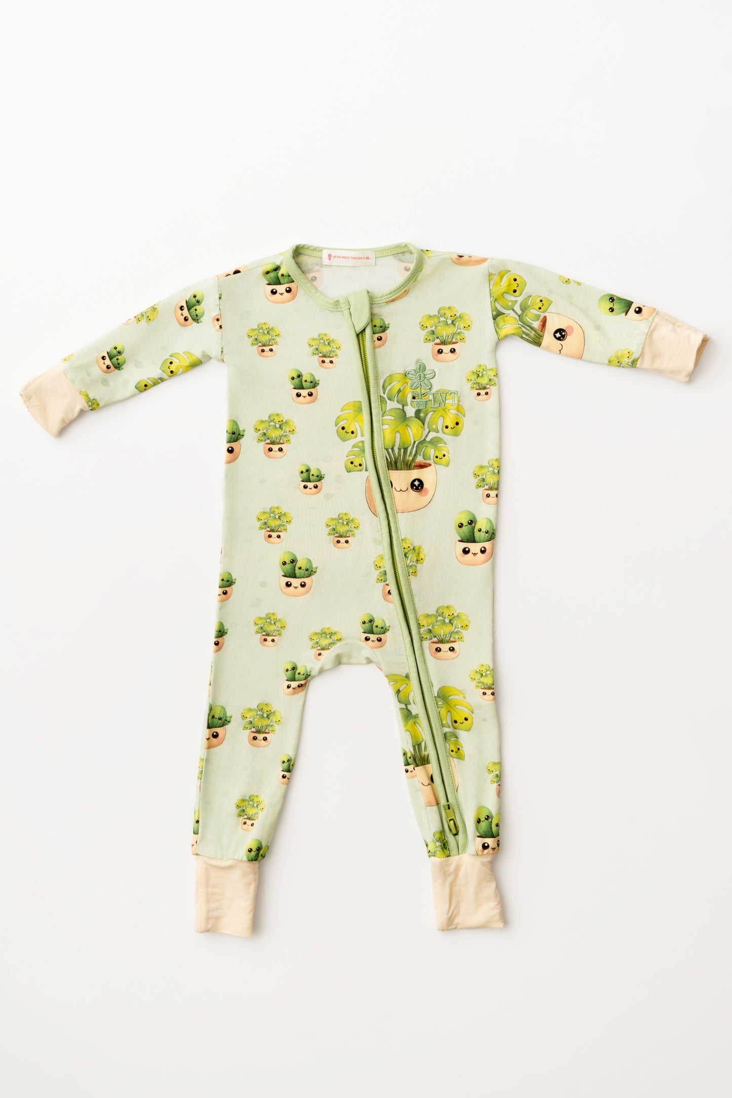 Baby onesie with potted plant pattern on a white background
