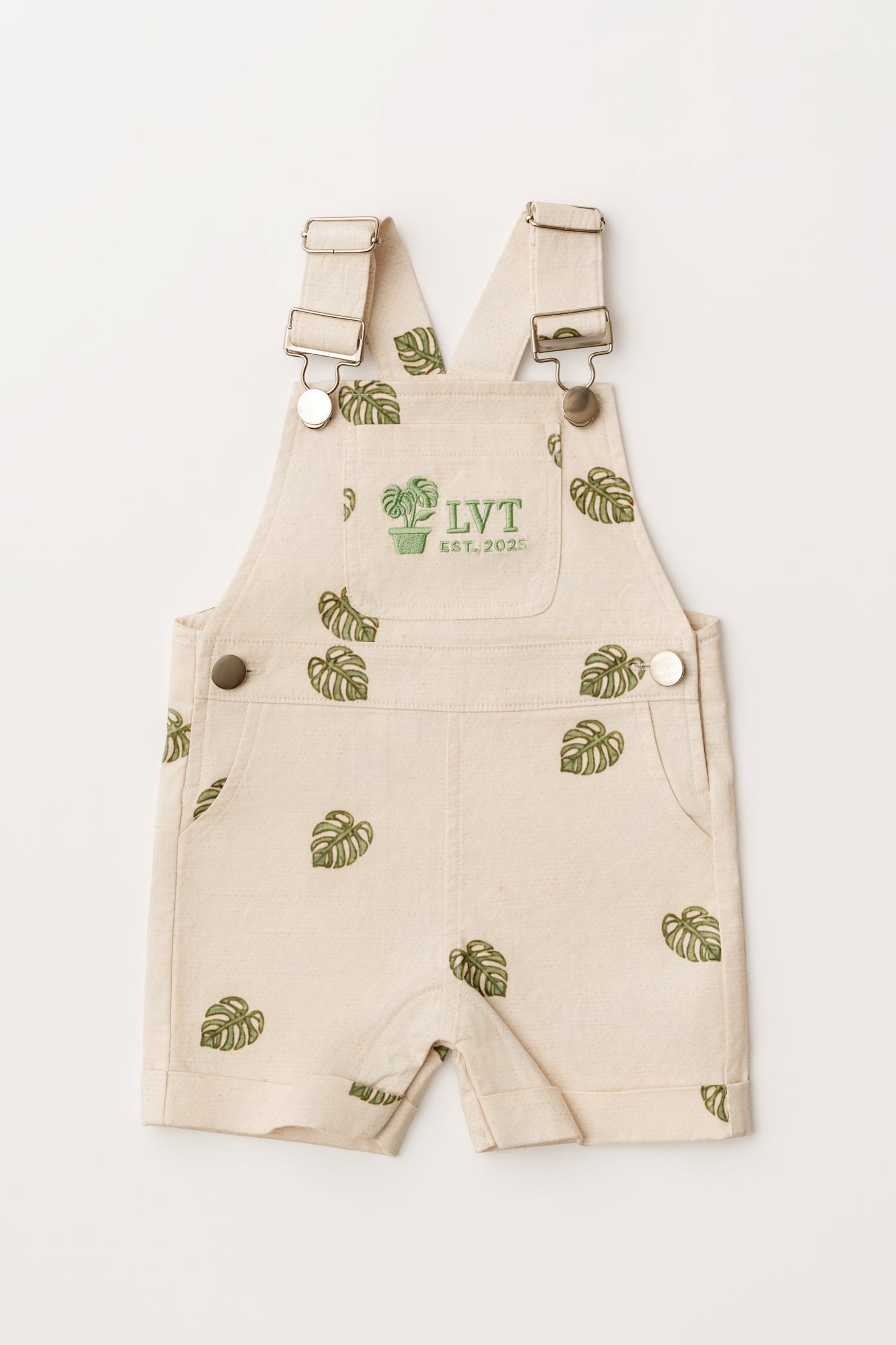 Beige Monstera Baby Overalls cotton leaf infant overalls flat lay on white background