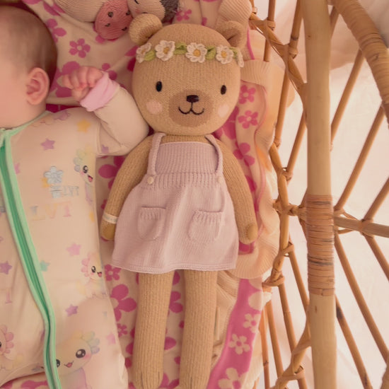 video of baby wearing little violet threads pastel bamboo baby zippy romper moving in bassinet