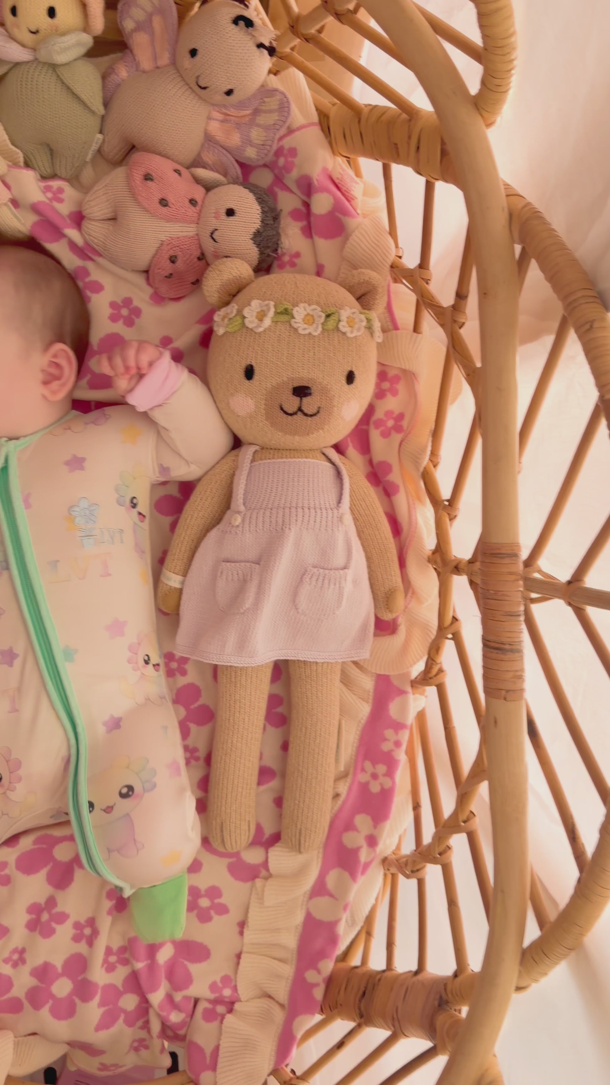 video of baby wearing little violet threads pastel bamboo baby zippy romper moving in bassinet