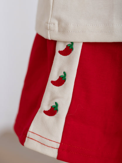 Close up detail of our Tiny But Spicy kids shorts featuring embroidered chilli accents and exclusive LVT design detailing 