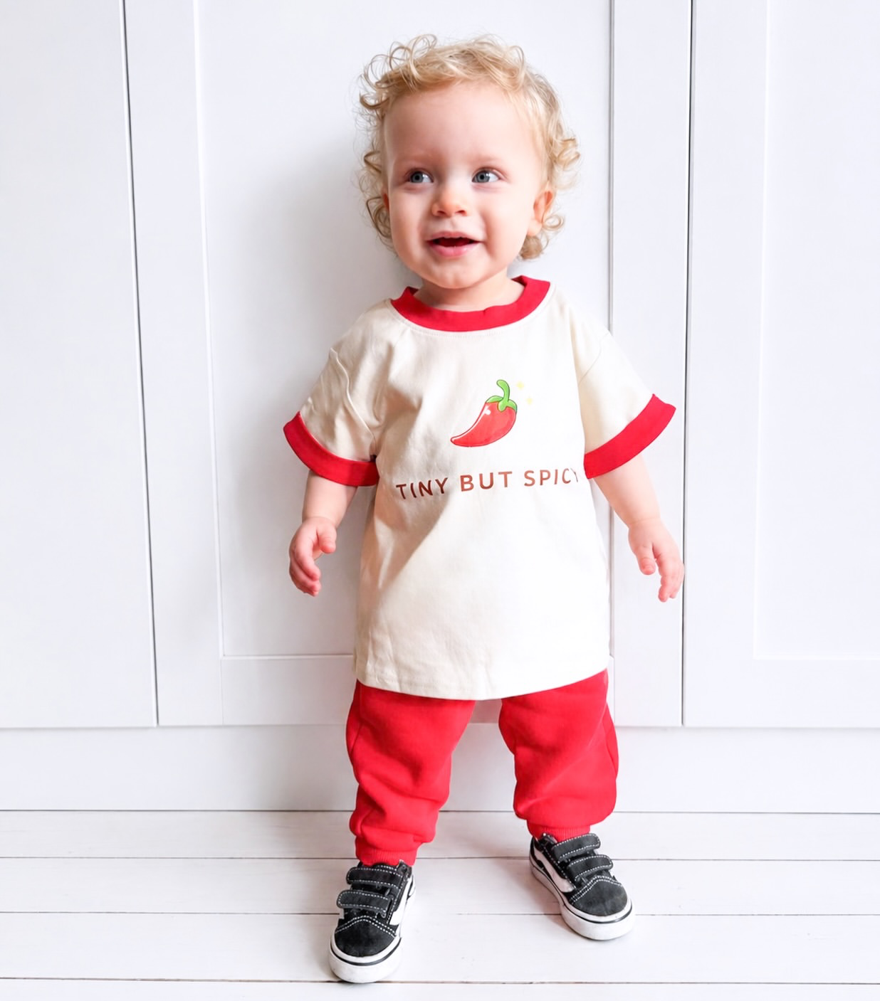 toddler wearing little violet threads tiny but spicy oversized tee with matching red pants